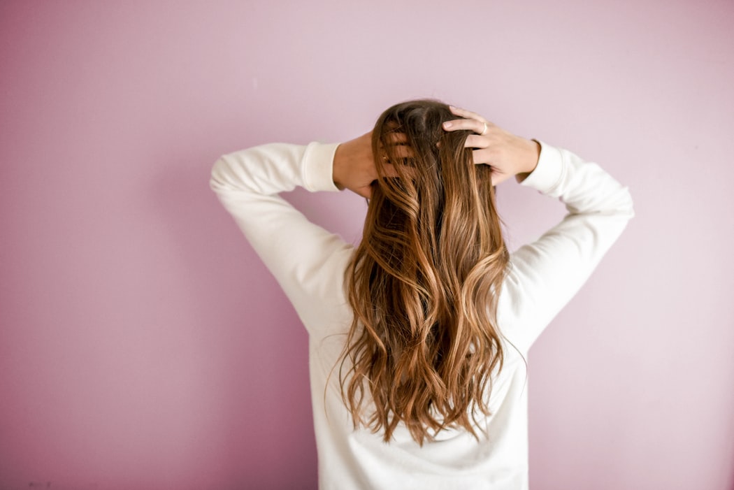 back of woman's long wavy hair