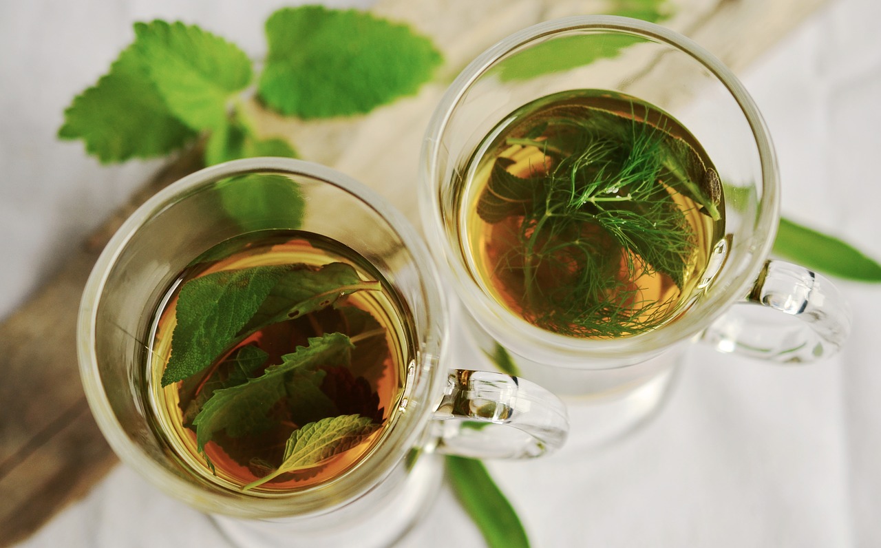 overview of tea with sage leaves inside as herbs