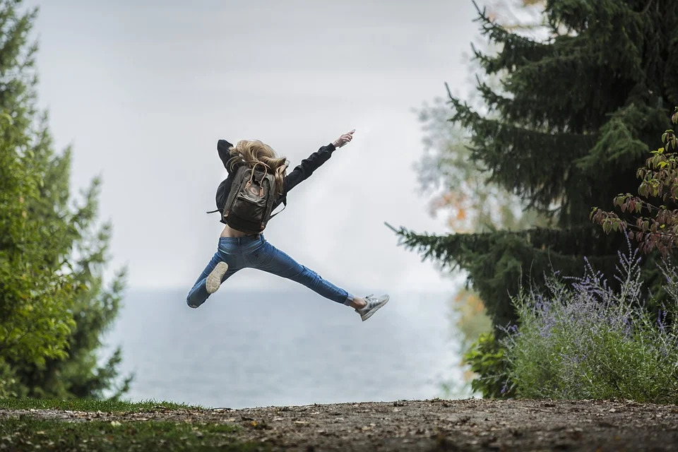 female jumping in the air with joy